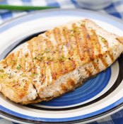 Grilled salmon filet on small dish.