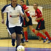 Jose Mourinho, coach of the London team Chelsea, joins an indoor game for a change of pace.