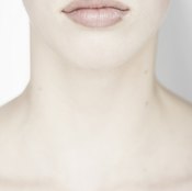 The thyroid is located at the right, lower front of the neck