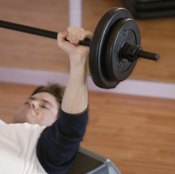 The bench press is completed lying on your back on a flat surface.