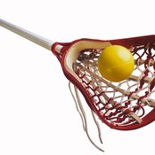 Lacrosse balls are designed to bounce; field hockey balls are not.