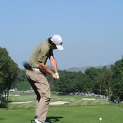 At the midpoint of his downswing, Rory McIlroy's firm wrists have maintained about a 90-degree angle between his left forearm and the club shaft.