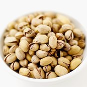 Pistachios and cashews both contain monounsaturated fats, which are beneficial to heart health.