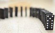 How Does the Distance Between Dominoes Affect the Rate at Which They Fall?