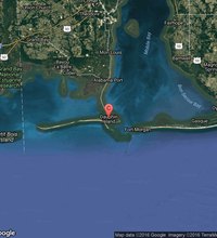 Dauphin Island, Alabama, is a quiet barrier island between the mouth of Mobile Bay and the Gulf of Mexico. The island has avoided build-up of tourist ...