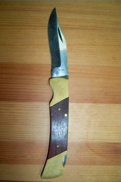 place the knife on a table with the blade out.