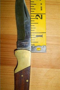 place the end of the measuring tape or ruler against where the blade meets the knife handle at the lowest