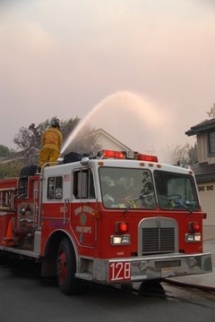 San Diego Fire Fighter image by Charles Kaye from Fotolia.com Homeowners insurance helps families to rebuild after a disaster.