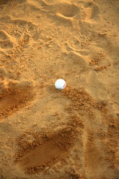 Dirt and sand on the ball can alter its flight path.