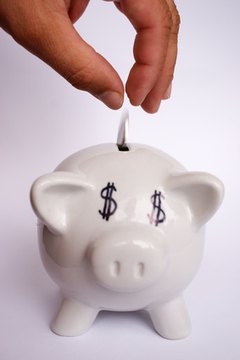 saving money image by Wojciech Gajda from Fotolia.com Invest your savings in a money market account or CD.