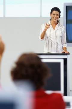 George Doyle/Stockbyte/Getty Images In-house trainers develop employees' skills.