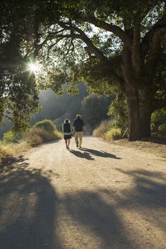 Siri Stafford/Lifesize/Getty Images Burn fat with low-intensity exercises such as walking.