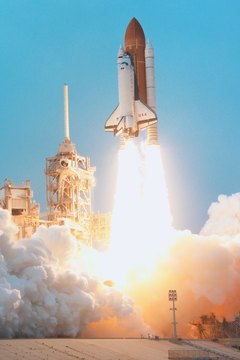 A rocket's exhaust produces thrust, accelerating the spacecraft.