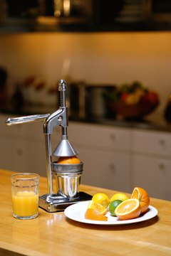 Creatas Images/Creatas/Getty Images Juicing has many benefits, but also a few negatives.