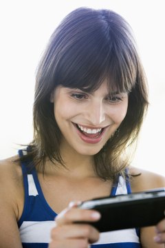 BananaStock/BananaStock/Getty Images Wear a smile every day at work when you play games for a living.