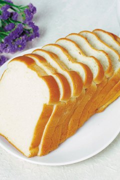 Media Bank/Photos.com/Getty Images Refined breads are fast-digesting carbohydrates.