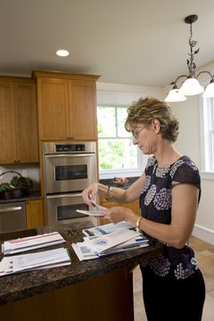David Sacks/Lifesize/Getty Images Debt consolidation makes paying bills less of a chore.