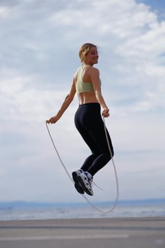 Ryan McVay/Photodisc/Getty Images Add jumping rope into your workout to improve endurance.