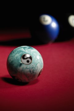 Henry Gan/Photodisc/Getty Images Stress balls come with many designs, but the Yin-Yang is popular.