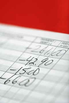 Thinkstock/Comstock/Getty Images Adding up liabilities is part of creating a balance sheet.