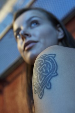 BananaStock/BananaStock/Getty Images Are tattoos acceptable at work?