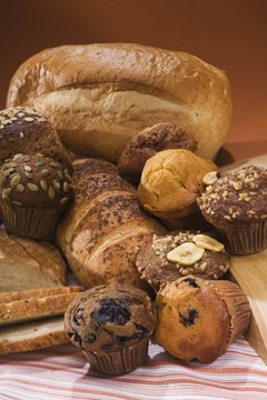 Jupiterimages/Comstock/Getty Images Whole-grain foods like brown bread can cause bloating.