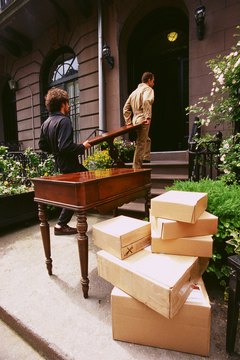 Creatas/Creatas/Getty Images Don't let delivery people in your house until you've inspected your furniture.