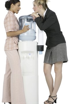 Photos.com/PhotoObjects.net/Getty Images Water cooler gossip can chill an office atmosphere.