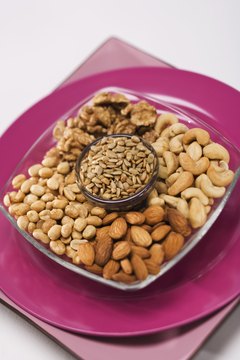 Jupiterimages/Comstock/Getty Images Nuts and seeds contain healthy fats.