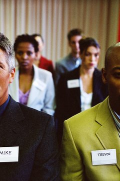 Stockbyte/Stockbyte/Getty Images Ideally you should wear your name tag near your right shoulder.