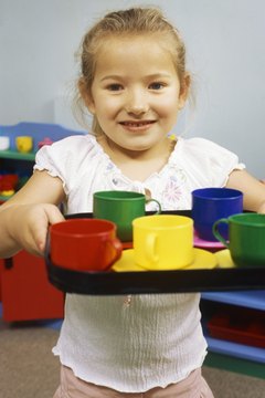 Preschool girl acting out the part of Martha.