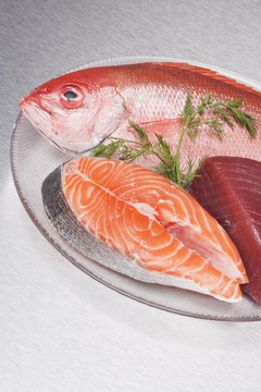 Comstock Images/Comstock/Getty Images The ASPCA recommends feeding tuna to your dog only as an occasional treat.