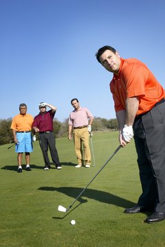 Hitting a cut shot in golf requires some subtle changes to your stance and swing.