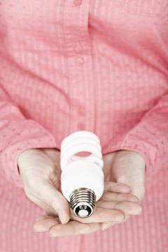 Jupiterimages/Photos.com/Getty Images Compact fluorescent light bulbs will save you money.