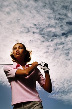 George Doyle/Stockbyte/Getty Images Golf club measurements depend on the distance from your hands to the ground.