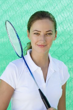 Polka Dot Images/Polka Dot/Getty Images Use the tension that fits your skill level in badminton.