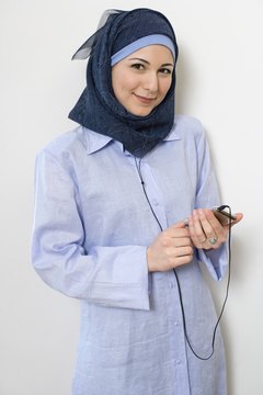 A Muslim woman may wear a headscarf.