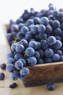 Alexandra Grablewski/Lifesize/Getty Images Concord grapes offer several health benefits.