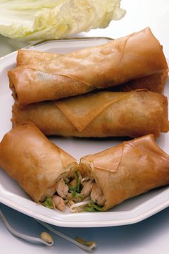 Jupiterimages/Photos.com/Getty Images Reduce fat and calories by starting your meal with egg drop soup instead of egg rolls.