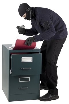 Photos.com/PhotoObjects.net/Getty Images Spies often appear only as curious employees.