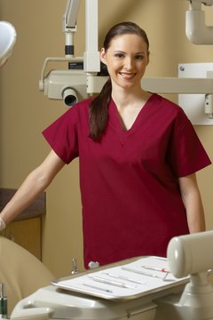 Jupiterimages/Photos.com/Getty Images Dental assistants perform technical work requiring a high degree of skill.
