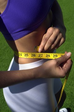 Thinkstock Images/Comstock/Getty Images Tone your waist and hips for that feminine figure you desire.