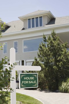 Jupiterimages/Comstock/Getty Images If your cards are maxed out, a mortgage is harder to get.
