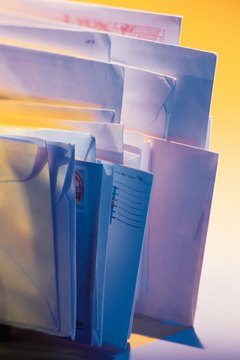 Comstock/Comstock/Getty Images Employers can open any mail delivered to their locations.
