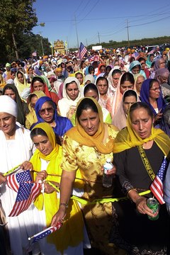 Sikh women, wearing traditional garb, practice a religion born in the 1500s.