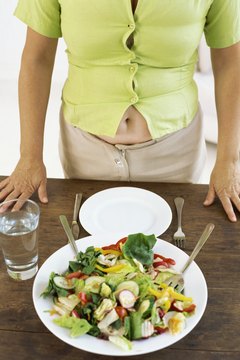 Stockbyte/Stockbyte/Getty Images A healthy diet will help make your stomach flat.