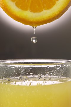 Hemera Technologies/AbleStock.com/Getty Images Drinking fresh-squeezed orange juice provides many benefits.