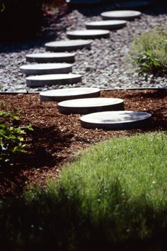 Dynamic Graphics Group/Dynamic Graphics Group/Getty Images Mix pavestones with multiple materials for a low-cost pathway.