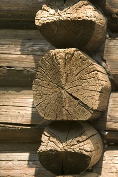 Comstock Images/Comstock/Getty Images Notched ends keep the logs of a log kit-home together.