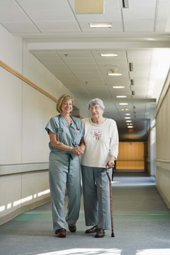 Jupiterimages/Comstock/Getty Images STNAs and CNAs care for residents of nursing homes and other elder-care facilities.